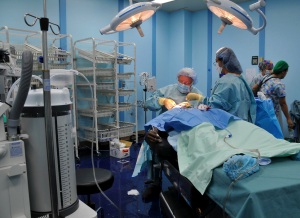 US_Navy_080811-N-9689V-004_Operation_Smile_volunteers_Dr._Robert_Russell,_a_plastic_surgeon_from_Springfield,_Ill.,_and_his_assistant_Maria_Velasquez,_perform_reconstructive_surgery_on_21-year-old_Solomon_Maitava